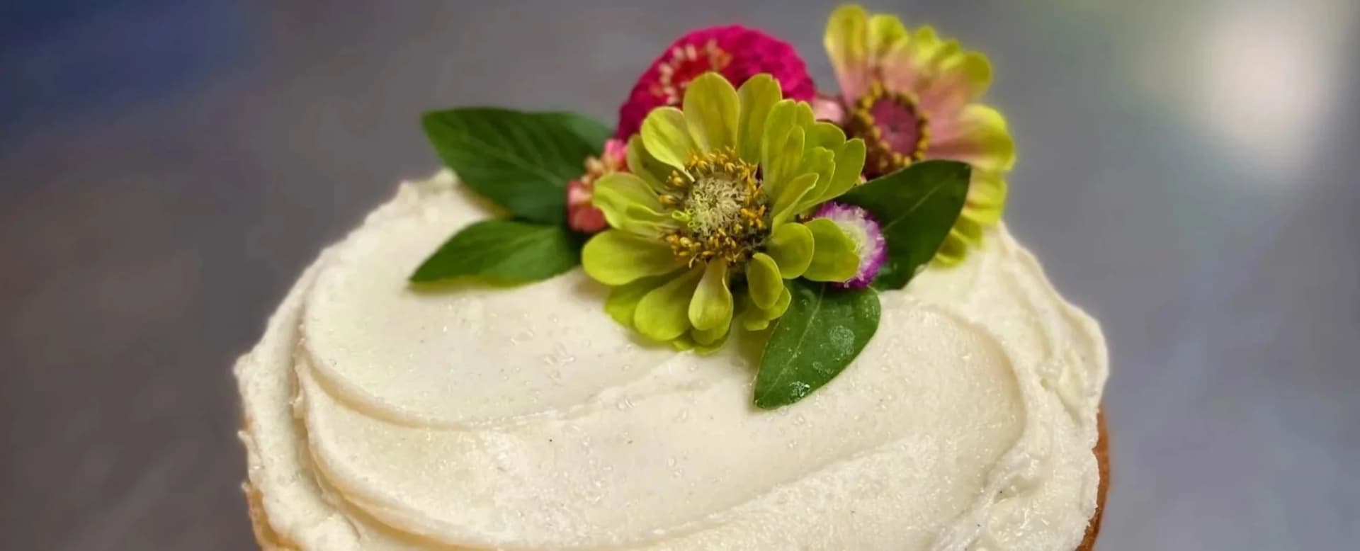 Buttercream cake finished with edible flowers